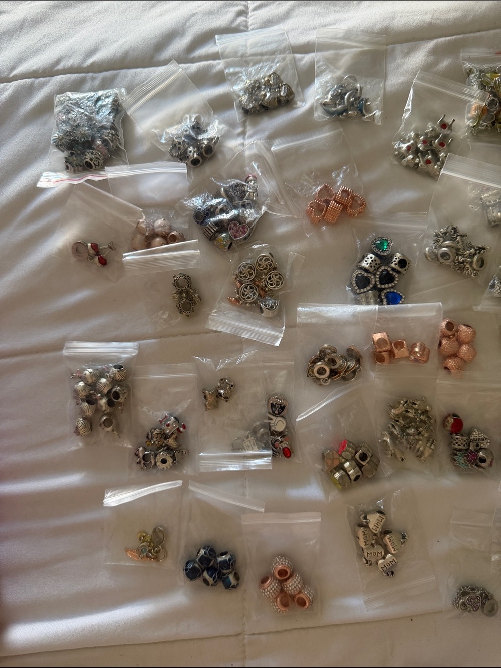 Lot of (50) bags Mixed Women’s Jewelry Charm Beads - Assorted Silver & Rose Gold